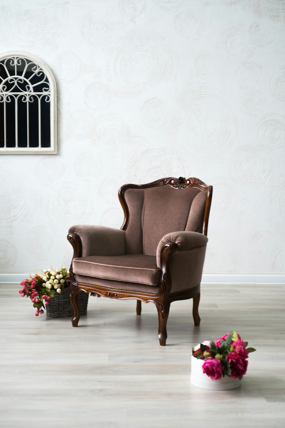 services-05 brown-leather-armchair-beside-pink-roses-nznvdtljvbw