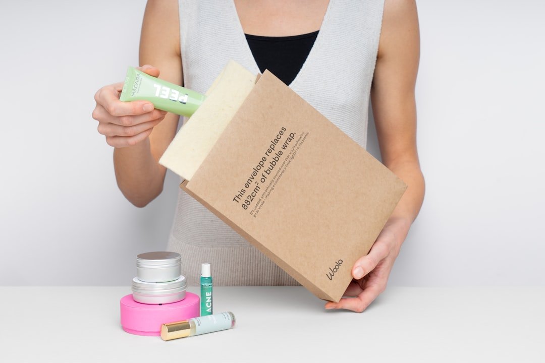 portfolio-02 woman-placing-skincare-product-into-a-package-cvqvvqjexci